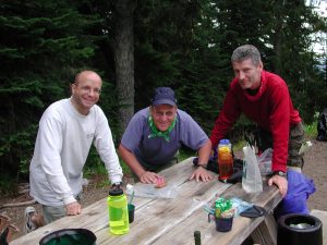 Carl with Mark and John, blowing out candles on this "birthday" cake.