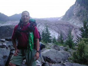 Carl standing in front of Carbon Glacier